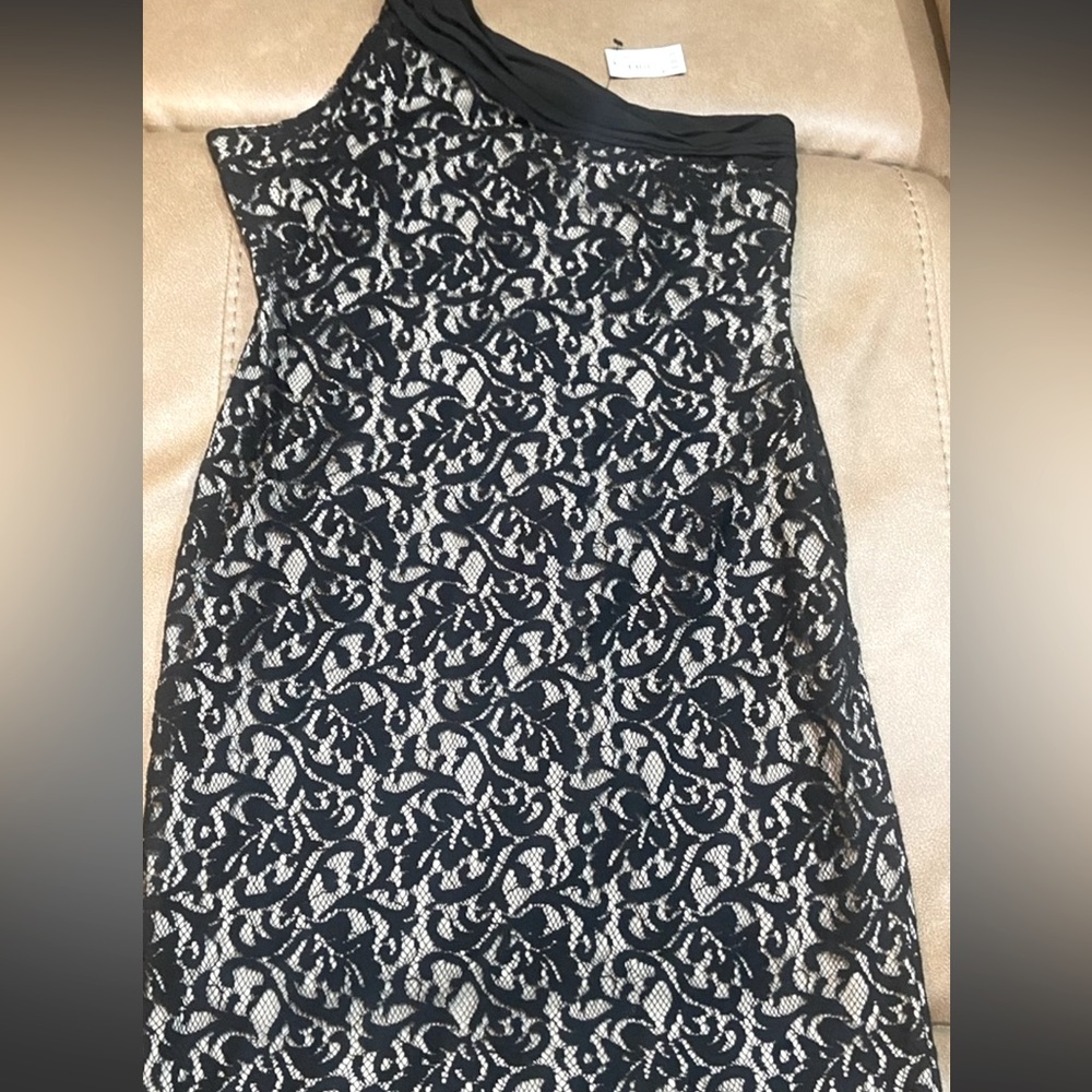 Limited Brand New with tags, lace one shoulder dress size 10. Smoke free home